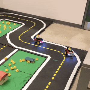 Duckiebots navigating curves in Duckietown using pure pursuit and obstacle avoidance with onboard object detection